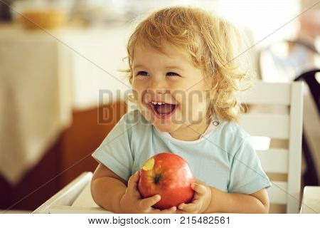 Laughing Baby Boy With Apple