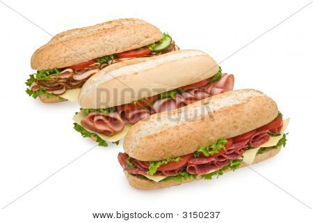 Three Delicious Submarine Sandwiches Isolated On White