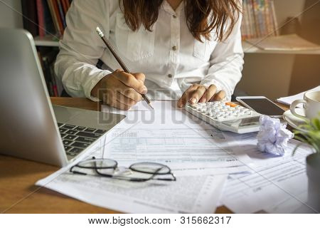 Budget Planning Concept,accountant Is Calculating Company's Annual Tax.calendar 2019 And Personal In