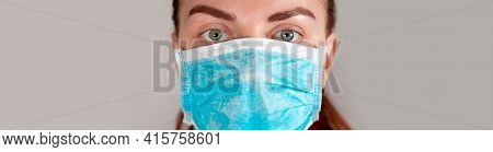 Young Girl In A Medical Mask Feels Bad . Sore Throat, Illness. Coronavirus, Covid 19