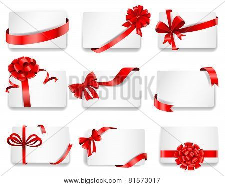 Festive cards with red gift ribbons.