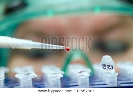 laboratory assistant analyzing a dangerous infection