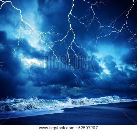 Lightning flashes across the beach from a powerful storm