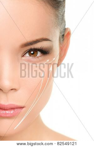 Face lift anti-aging treatment - Asian woman portrait with graphic lines showing facial lifting effect on skin.