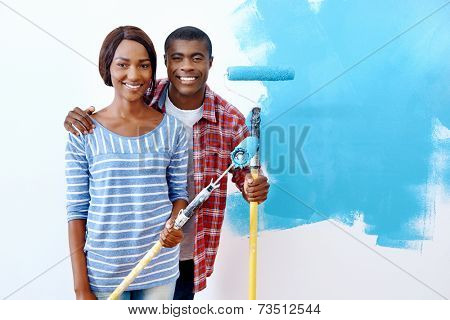 Fresh coat of paint on new apartment for young black african couple who have success and a home