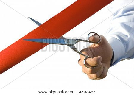 Red ribbon cutting with a pair of scissors for the inauguration of the new business activity in white background