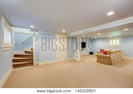 Spacious Basement Room Interior In Pastel Blue Tones