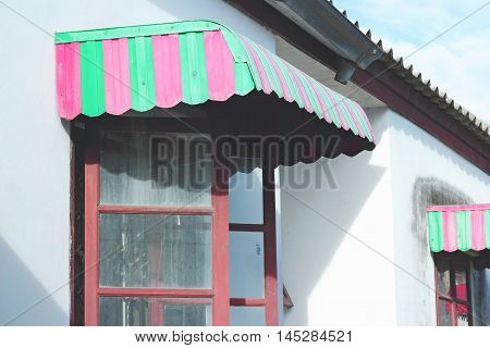 Red And Green Awning Window