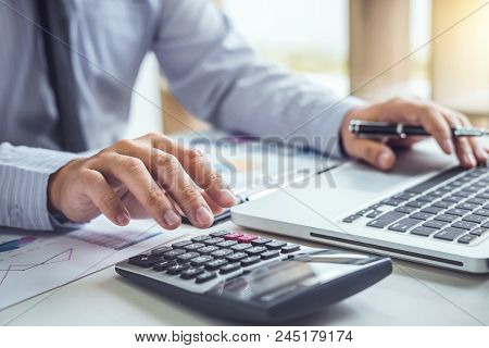 Business Man Or Accountant Working Financial Investment On Calculator With Calculate Analyze Busines