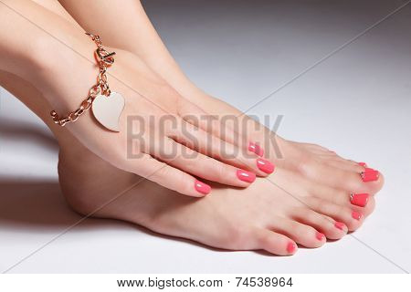 Manicured Nails And Pedicured Toes With Gel Polish