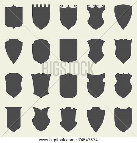 Set of blank empty dark shields. Shield badge shapes icon