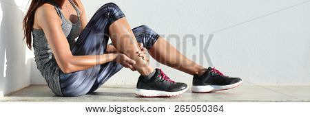 Running sport injury leg pain - runner woman runner hurting holding painful sprained ankle muscle. Female athlete with joint or muscle soreness and problem feeling ache banner panorama.