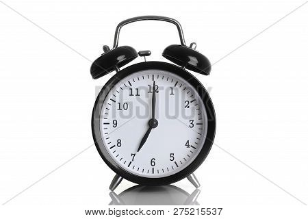 Black Alarm Clock Isolated On White Background Shows Seven O Clock In The Morning Time To Get Up To 