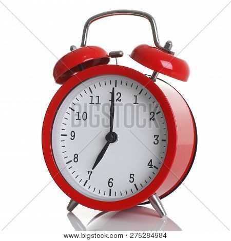 Red Alarm Clock Isolated On White Background Shows Seven O Clock In The Morning Time To Get Up To Wa