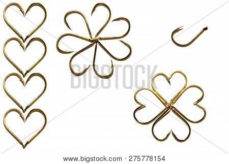 Fishing Hooks In Gold Color. Different Patterns Of Metal Fishing Hooks. Abstraction. Isolated.