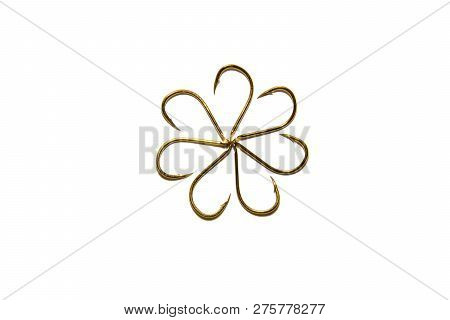 Fishing Hooks In Gold Color. Different Patterns Of Metal Fishing Hooks. Abstraction. Isolated.