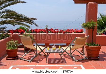 Terrace, Table, Chairs And Sea Views