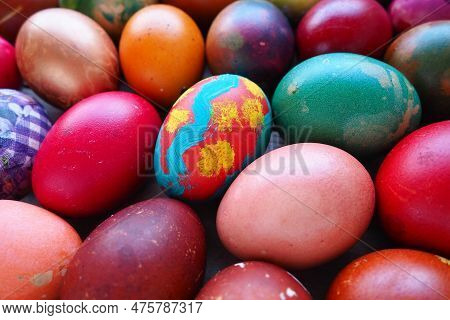 Easter Colorful Eggs Close Up. Many Colorful Holiday Eggs Are Stacked Close To Each Other. Boiled Ch