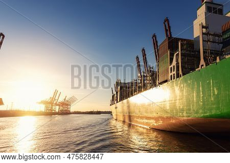 Scenic View Giant Cargo Container Ship Loading Hamburg City Port Harbour Against Seaport Cranes Warm