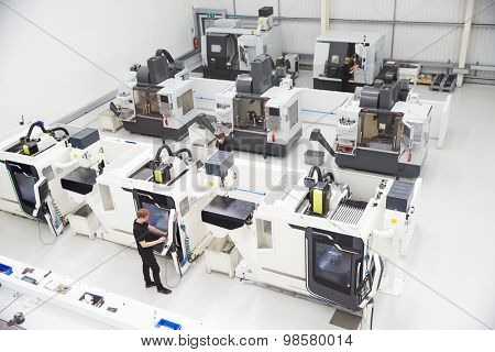 High Angle View Of Engineering Workshop With CNC Machines