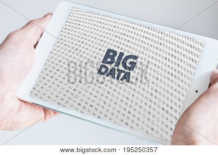 Two hands holding tablet. Big data concept.