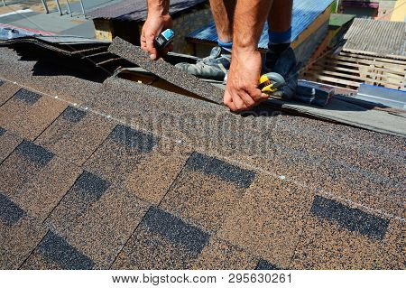 Repairing Of Roof By Cutting Felt Or Bitumen Shingles During Waterproofing Works.