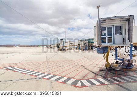 Fuerteventura, Spain - May 15, 2013. Empty Line Of Jet Bridges, Airbridge (passenger Boarding Bridge