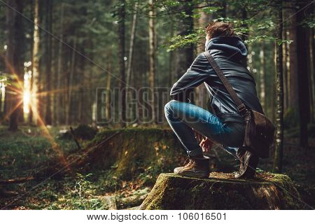 Young Man Exploring The Forest