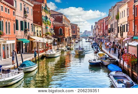 Island murano in Venice Italy. View on canal with boat and motorboat water. Picturesque landscape.