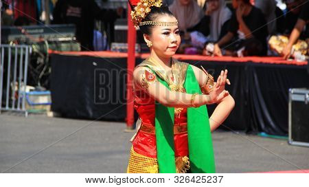 A Group Of Dancers While Performing On The Street Stage, Dancing To Traditional Javanese Dance, Peka