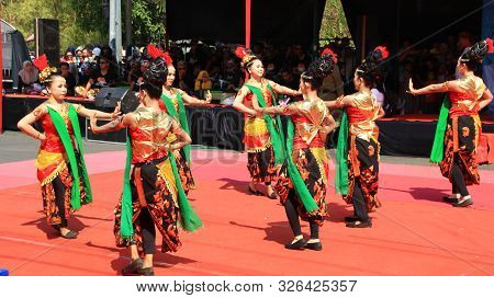 A Group Of Dancers While Performing On The Street Stage, Dancing To Traditional Javanese Dance, Peka