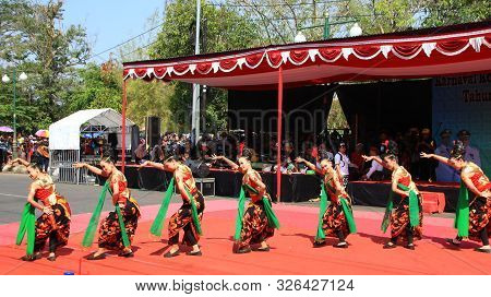 A Group Of Dancers While Performing On The Street Stage, Dancing To Traditional Javanese Dance, Peka