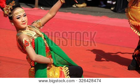 A Group Of Dancers While Performing On The Street Stage, Dancing To Traditional Javanese Dance, Peka