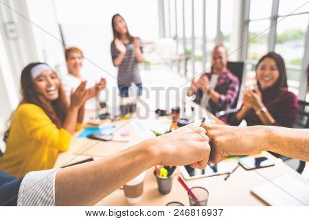 Business Partners Or Men Coworkers Fist Bump In Team Meeting, Multiethnic Diverse Group Of Happy Col