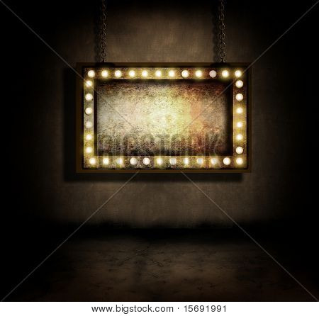 An old marquee sign hanging in a dark room