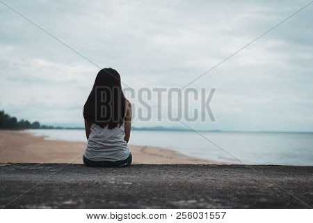 Young Lonely Woman In Depression. Asian Woman Feel Sad Sitting Alone And Depressed On The Floor, Sad