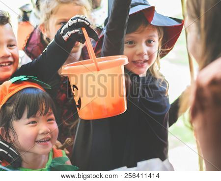 Little children trick or treating on Halloween