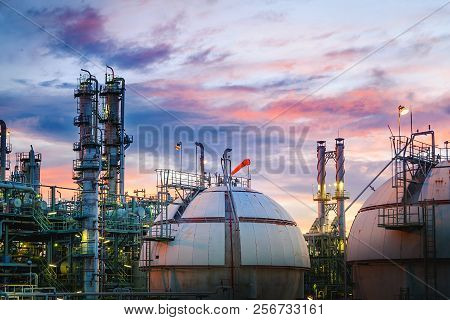 Petrochemical Plant On Sunset Sky Background With Gas Storage Sphere Tanks, Manufacturing Of Petrole