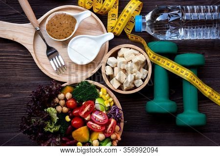 Diet Healthy Food And Lifestyle Health Concept. Sport Exercise Equipment Workout and gym Background 