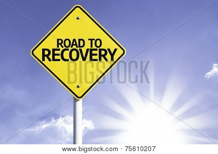 Road To Recovery road sign with sun background 