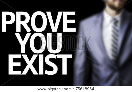 Prove you Exist written on a board with a business man on background