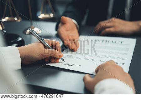 Closeup Businessman Sign Contract Or Legal Document With Pen In His Hand During Corporate Meeting Fo