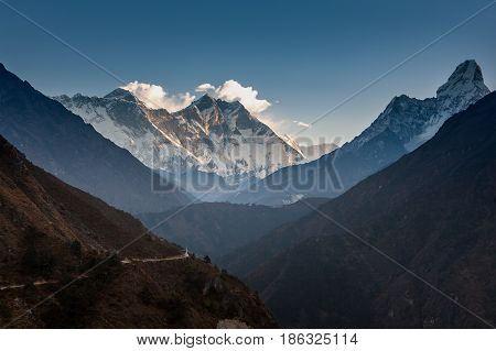 View Over The Hill With Mountain Trail And Snowy Mountains On The Background. Ama Dablam And Lhotse