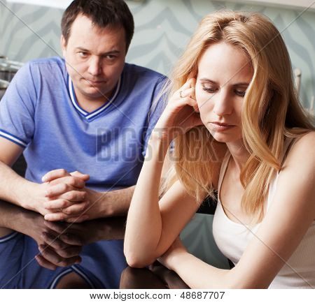 Conflict in couple. Problems in family. Sad man and woman