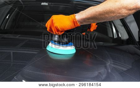 Car Polish Wax Worker Hands Applying Protective Tape Before Polishing. Buffing And Polishing Car. Ca