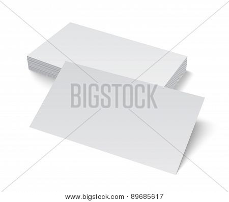 Stack of blank business card on white background with shadows.