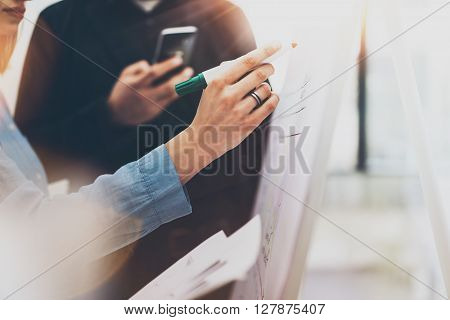 Business meeting office.Photo woman writing statistics info chart board.Photo account managers crew working with new startup project.Idea presentation, analyze marketing plans.Blurred, horizontal