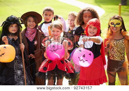 Children In Fancy Costume Dress Going Trick Or Treating