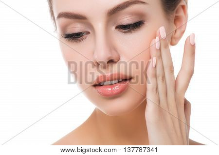 Portrait of young beautiful caucasian woman touching her face isolated over white background. Cleaning face perfect skin. SPA therapy skincare cosmetology and plastic surgery concept