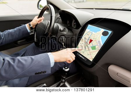 transport, destination, navigation, modern technology and people concept - close up of man driving car with gps navigator map on board computer screen